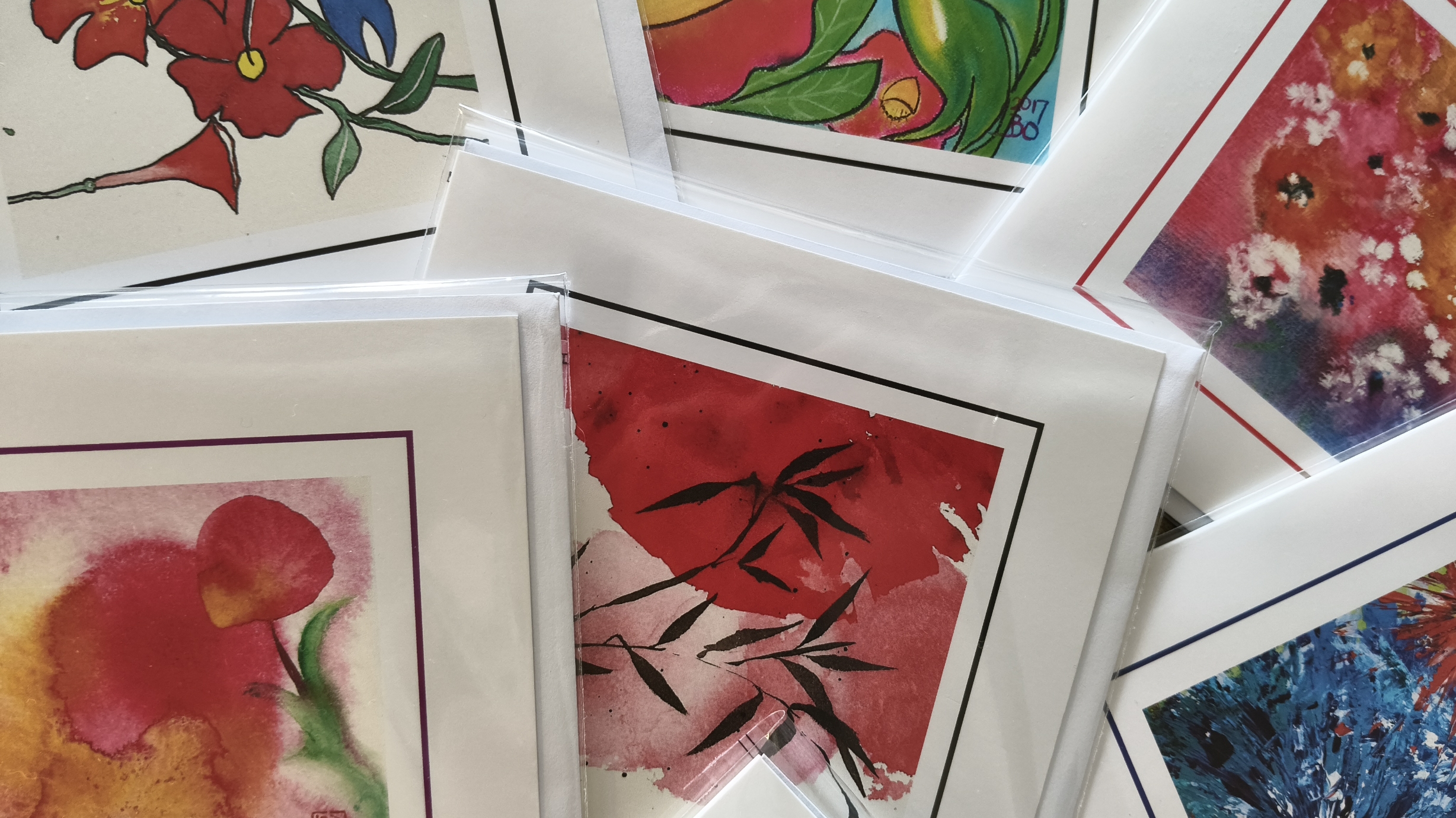 Detailausschnitt verschiedener boART Card Motive mit farbenfrohen Tuschearbeiten von Barbara Ossberger